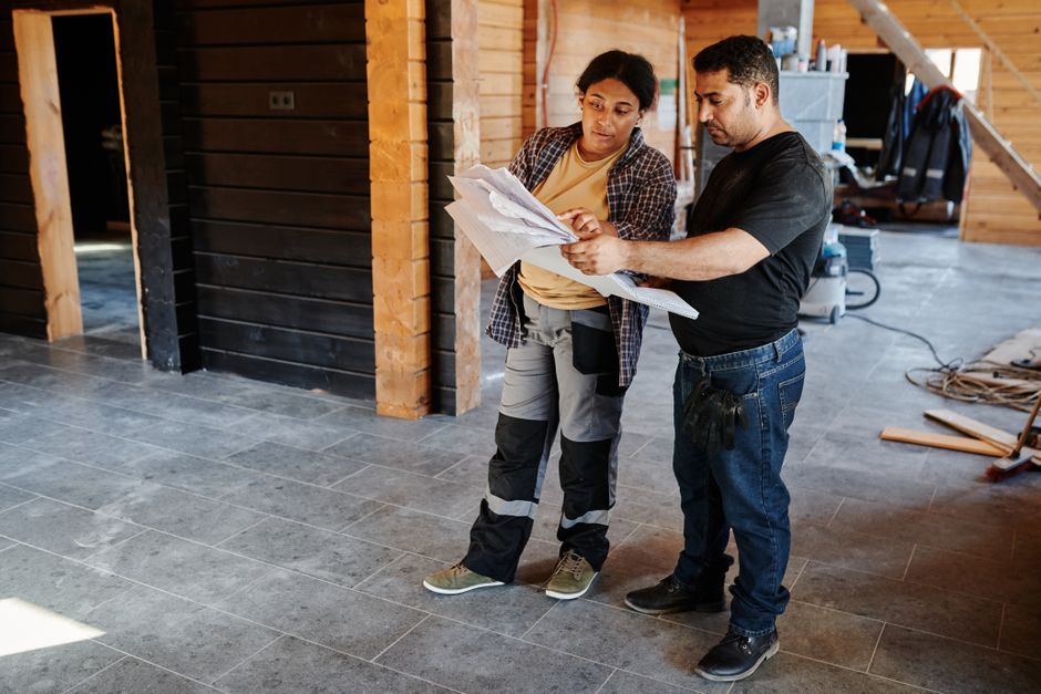 General contractor reviewing blueprints for a home renovation project